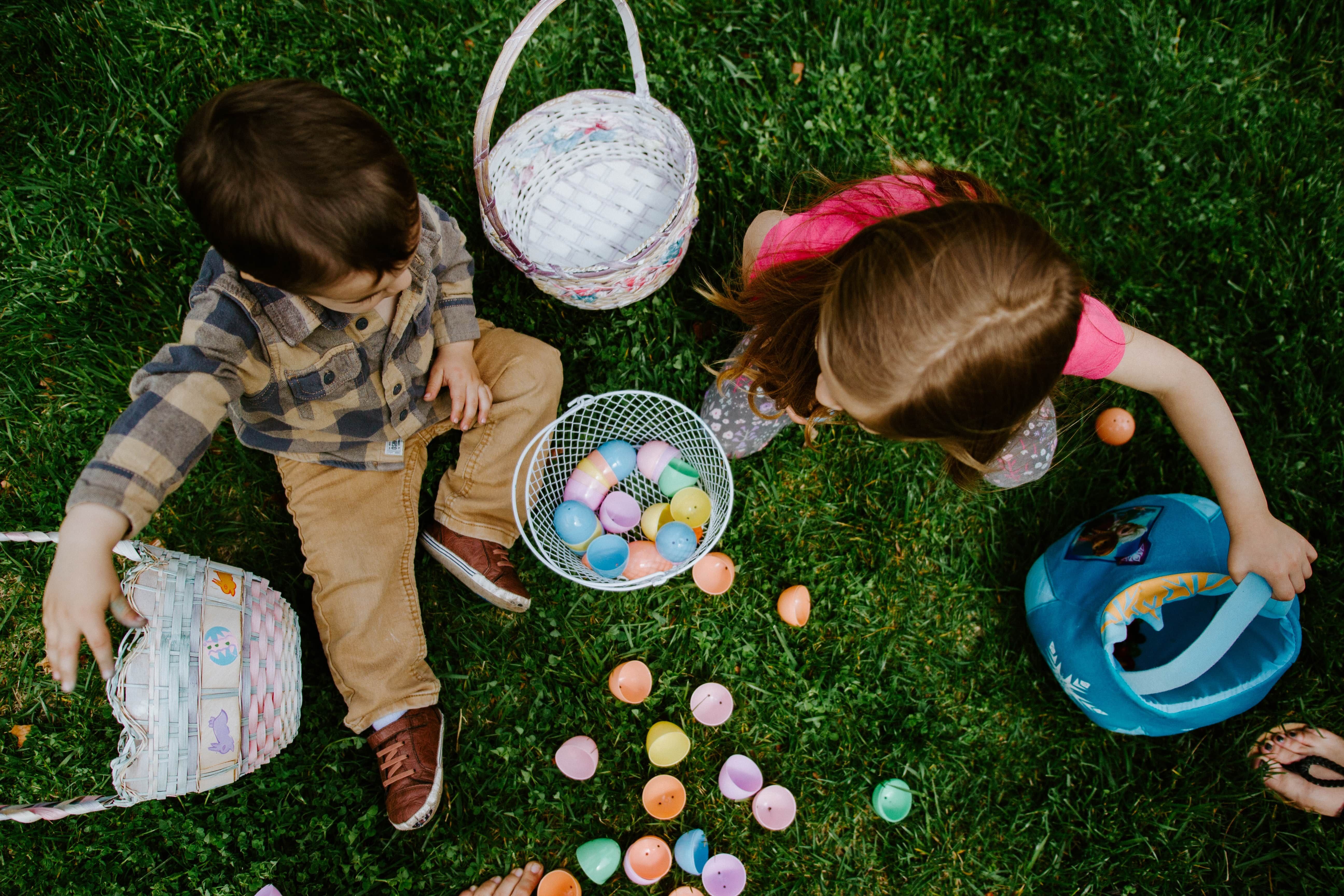 Two children playing with easter eggs